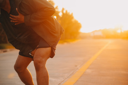 Athlete runner feet running on road, Jogging concept at outdoors. Man running for exercise.