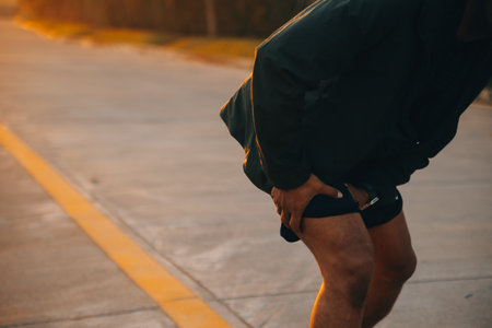 Athlete runner feet running on road, Jogging concept at outdoors. Man running for exercise.の写真素材