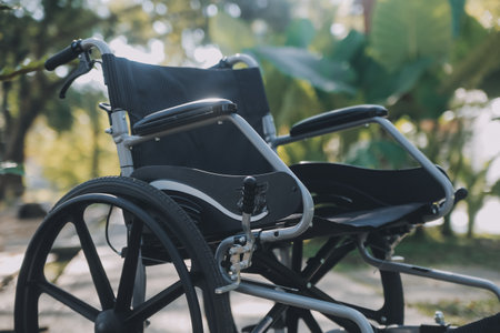 Single wheelchair parked in hospital hallwayの写真素材