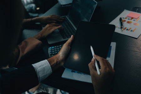 Finance manager meeting discussing company growth project success financial statistics, professional investor working start up project for strategy plan with document, laptop and digital tablet.の写真素材