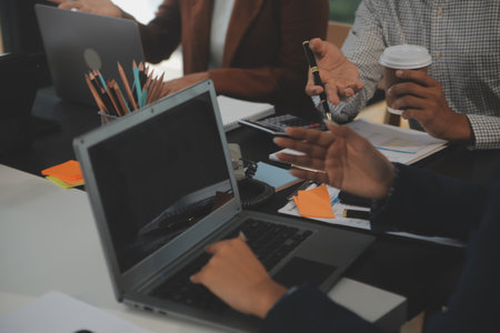 Business team meeting working with new startup project, discussion and analysis data the charts and...