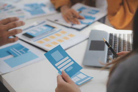 Close up ux developer and ui designer use augmented reality brainstorming about mobile app interface...