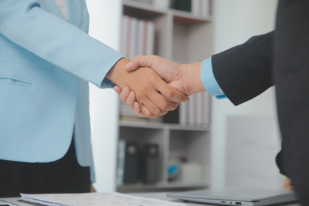 Close up view of job interview in office, focus on resume writing tips, employer reviewing good cv of prepared skilled applicant, recruiter considering application, hr manager making hiring decisionの写真素材