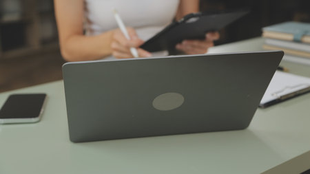 Asian businesswoman working on laptop computer Look for job online, freelance looking and typing on...