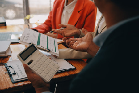 Group of Young Asian business team creative businesspeople coworker in office Happy to be successful partnership teamwork celebrating achievement and success concept.の写真素材