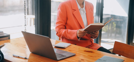 Group of Young Asian business team creative businesspeople coworker in office Happy to be successful partnership teamwork celebrating achievement and success concept.の写真素材