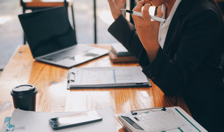 Asian women are stressed while working on laptop, Tired asian businesswoman with headache at office,...