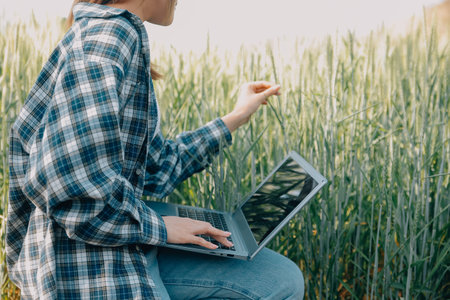 Smart farm. Farmer with tablet in the field. Agriculture, gardening or ecology concept. Harvesting....