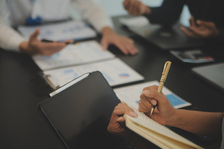 Business team collaboration discussing working analyzing with financial data and marketing growth report graph in team, presentation and brainstorming to strategy planning making profit of company.の写真素材