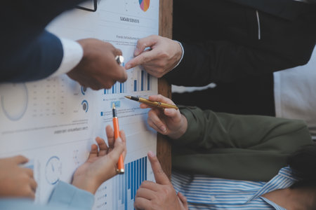 Co working conference, Business team meeting present, investor colleagues discussing new plan financial graph data on office table with laptop and digital tablet, Finance, accounting, investment.の写真素材