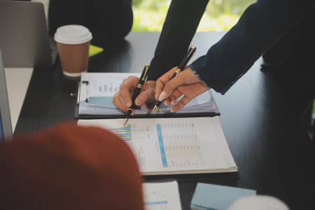 Business team meeting working with new startup project, discussion and analysis data the charts and...