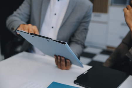 Close up of Business team analyzing income charts and graphs with modern laptop computer. Business analysis and strategy concept.の写真素材