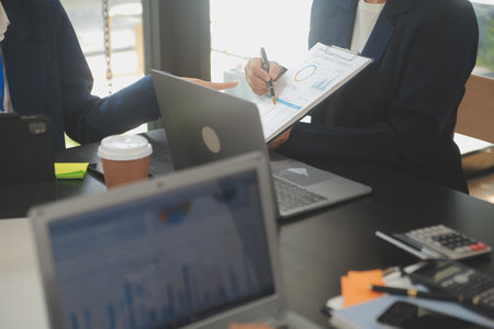 Business team meeting working with new startup project, discussion and analysis data the charts and...