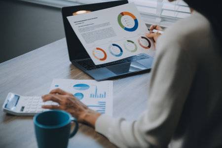 Businessmen are calculating income-expenditure and analyzing real estate investment data, Accounting...