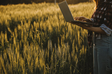 Smart farm. Farmer with tablet in the field. Agriculture, gardening or ecology concept. Harvesting....