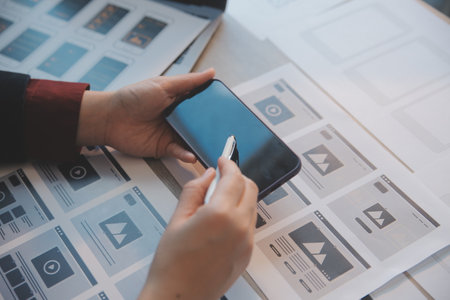 UX UI design process for modish mobile application and website . Creative prototype of wireframe for professional app developer .の写真素材