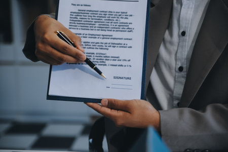 Real estate agent talked about the terms of the home purchase agreement and asked the customer to...