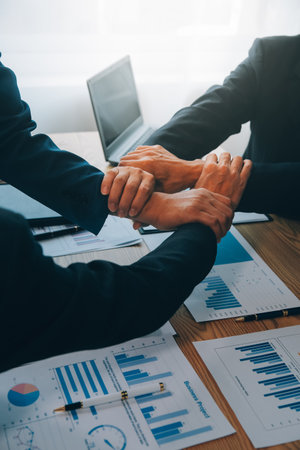 Business people join hands to join forces as a teamwork.の写真素材
