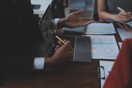 Finance manager meeting discussing company growth project success financial statistics, professional investor working start up project for strategy plan with document, laptop and digital tablet.の写真素材