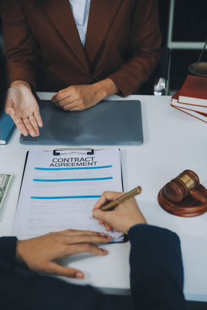 Businessman and lawyer discuss the contract document. Treaty of the law. Sign a contract business.の写真素材