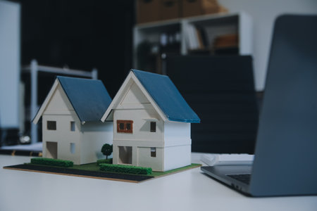 Real estate agent talked about the terms of the home purchase agreement and asked the customer to sign the documents to make the contract legally, Home sales and home insurance concept.の写真素材