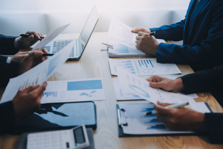 Meeting to present the Finance Executive business team. Discuss meetings to plan work, investment projects, analysis strategies, and discuss financial graphs and company budgets in the office.の写真素材
