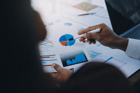Business team collaboration discussing working analyzing with financial data and marketing growth report graph in team, presentation and brainstorming to strategy planning making profit of company.の写真素材