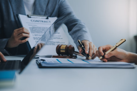 Businessman and lawyer discuss the contract document. Treaty of the law. Sign a contract business.の写真素材