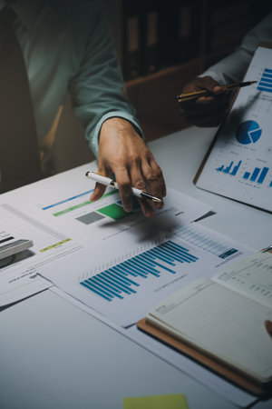 Business team meeting present, investor colleagues consultation and conference new strategy plan business and market growth on financial document graph report, Meeting and Talking.の写真素材