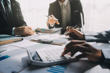 Business team meeting present, investor colleagues consultation and conference new strategy plan business and market growth on financial document graph report, Meeting and Talking.の写真素材