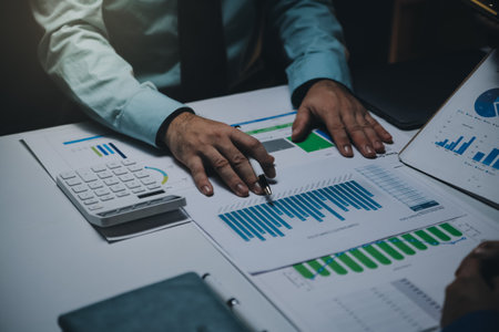 Business team meeting present, investor colleagues consultation and conference new strategy plan business and market growth on financial document graph report, Meeting and Talking.の写真素材