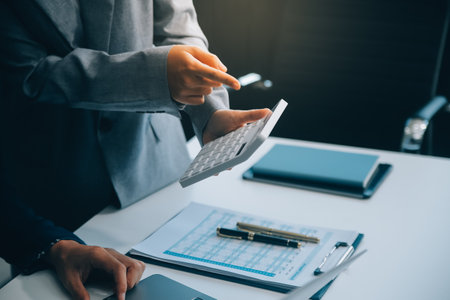 Business Documents, Auditor businesswoman checking searching document legal prepare paperwork or report for analysis TAX time,accountant Documents data contract partner deal in workplace officeの写真素材
