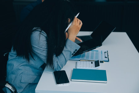 Business Documents, Auditor businesswoman checking searching document legal prepare paperwork or report for analysis TAX time,accountant Documents data contract partner deal in workplace officeの写真素材