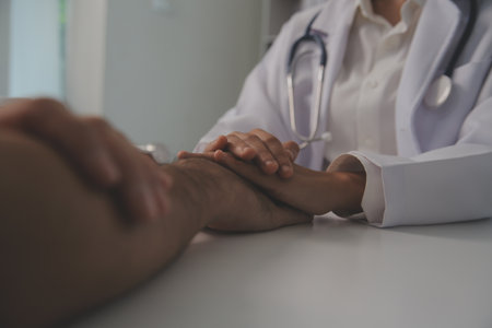 Homecare nursing service and elderly people cardiology healthcare. Close up of young hispanic female doctor nurse check mature caucasian man patient heartbeat using stethoscope during visitの写真素材
