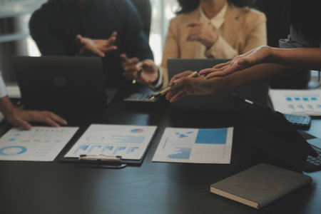 Business team collaboration discussing working analyzing with financial data and marketing growth report graph in team, presentation and brainstorming to strategy planning making profit of company.の写真素材