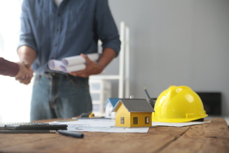 Handshake. Close up construction worker people shaking hands on business cooperation agreement. Successful hands shaking after good dealの写真素材