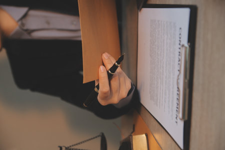 Business and lawyers discussing contract papers with brass scale on desk in office. Law, legal...