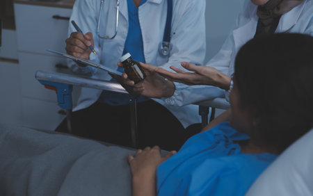 Doctor and patient discussing something while sitting at the table . Medicine and health care concept. Doctor and patientの写真素材