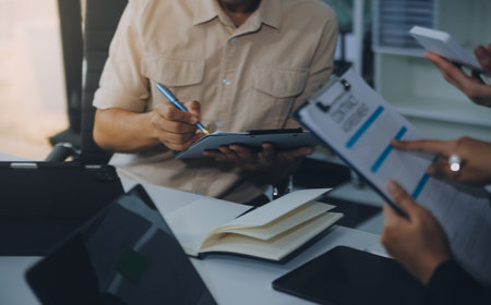 Finance manager meeting discussing company growth project success financial statistics, professional investor working start up project for strategy plan with document, laptop and digital tablet.の写真素材