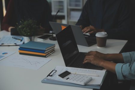 Team of business people working together in the meeting room office, teamwork background charts and graphs banner, double exposure successful teamwork,business planning concept.の写真素材