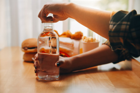 healthy beautiful young woman holding glass of waterの写真素材