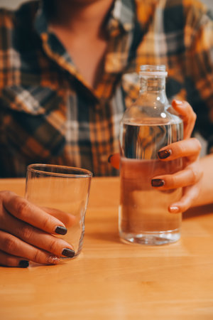 healthy beautiful young woman holding glass of waterの写真素材