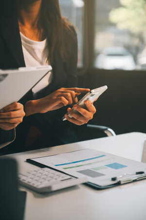 Team of business people working together in the meeting room office, teamwork background charts and graphs banner, double exposure successful teamwork,business planning concept.の写真素材