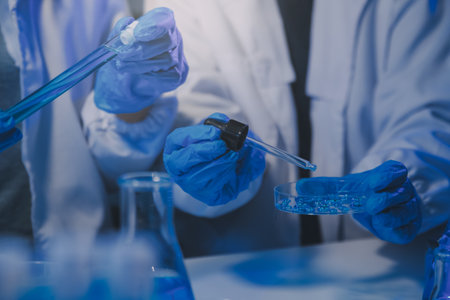 chemist,scientist hand dropping chemical liquid into test tube, science research and development...