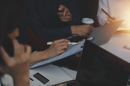 Team of business people working together in the meeting room office, teamwork background charts and graphs banner, double exposure successful teamwork,business planning concept.の写真素材