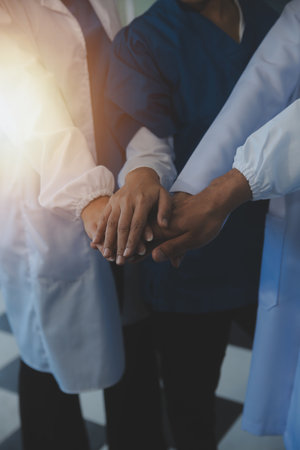 Group of Doctors and nurses coordinate hands to trust. Concept Teamwork healthy and medical in...