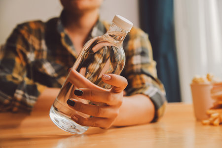 healthy beautiful young woman holding glass of waterの写真素材