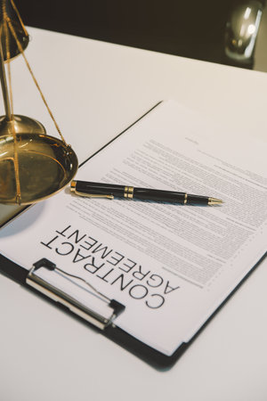 Lawyer, legal advisor, businessman brainstorming information on agreement details Business contracts in legal processing books for accuracy in contract documents. joint financial investment.の写真素材