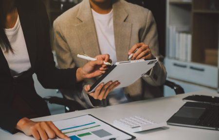 Team of business people working together in the meeting room office, teamwork background charts and graphs banner, double exposure successful teamwork,business planning concept.の写真素材