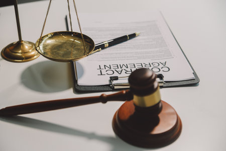Lawyer, legal advisor, businessman brainstorming information on agreement details Business contracts in legal processing books for accuracy in contract documents. joint financial investment.の写真素材
